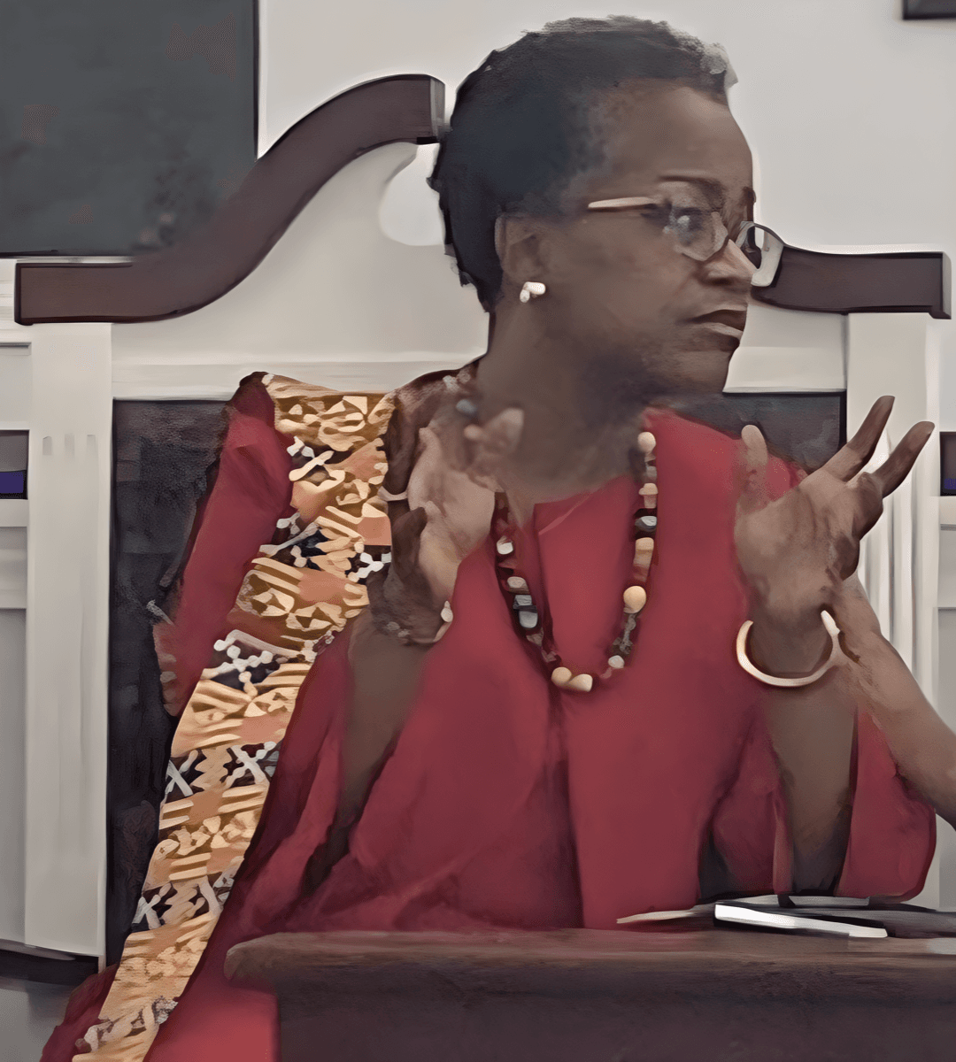 Rhonda Cooper speaking passionately at a community gathering