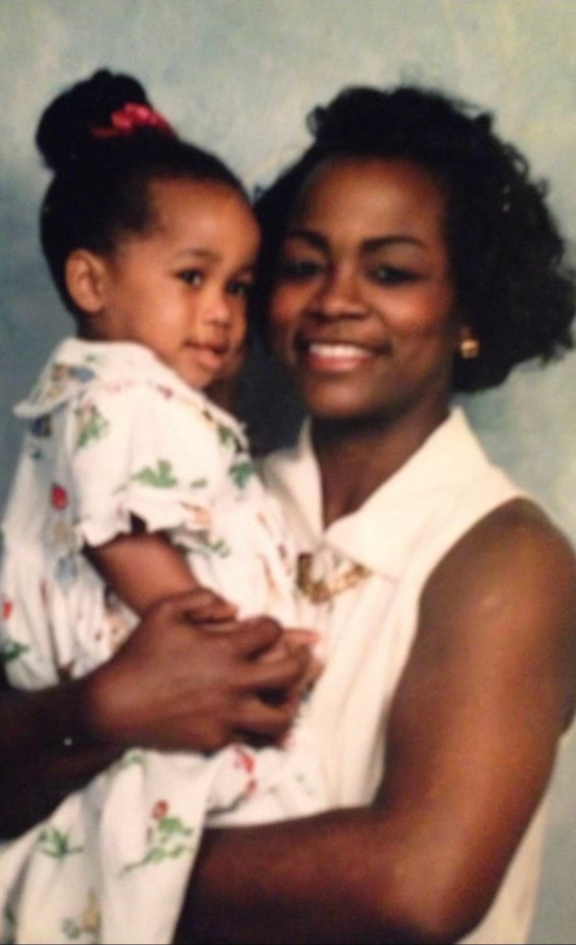 Young Rhonda holding her daughter — a portrait from their early years in Ridgeland